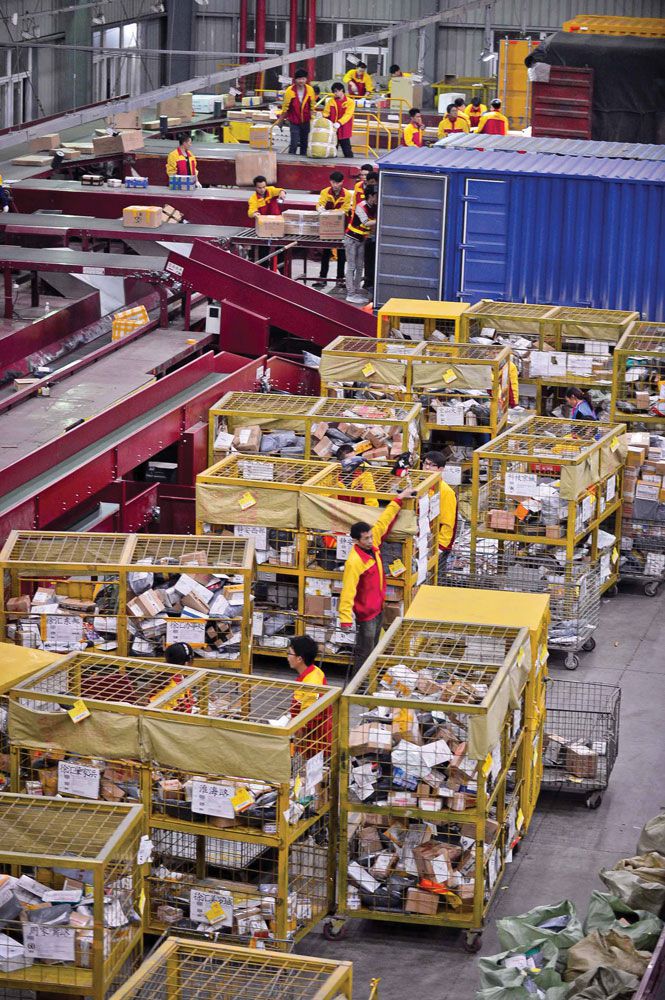 At a Shanghai distribution line for the Yunda courier company, workers toil all night long to meet demand over Singles&#x27; Day