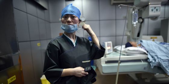 Female Chinese doctor preparing